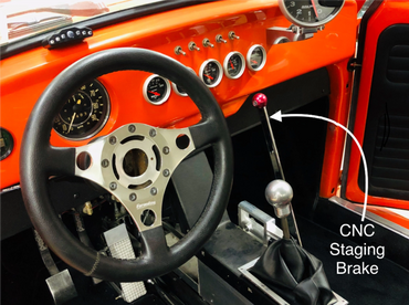 dashboard of orange VW race car