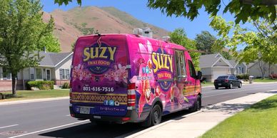Suzy Thai Food Truck during Neighborhood Delivery Program. Utah Street with grass trees mountains