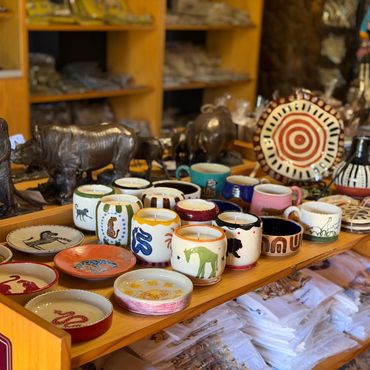Handcrafted animal-themed pottery and sculptures in a shop.