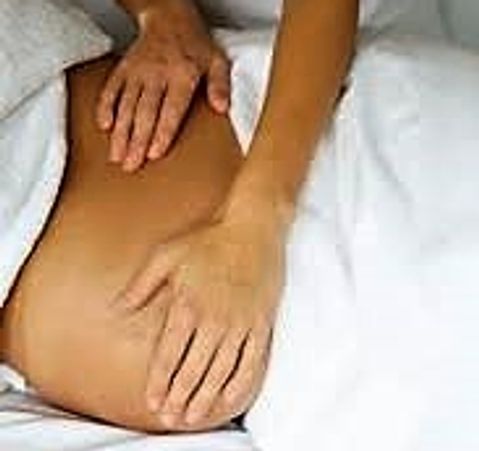 Person receiving a relaxing back massage.
