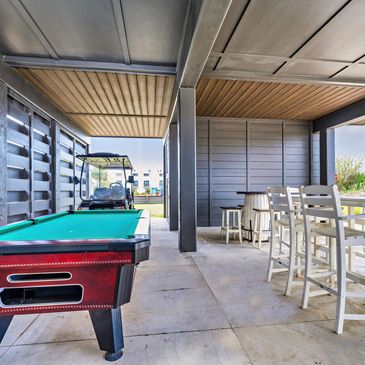Outdoor seating and pool table and golf cart