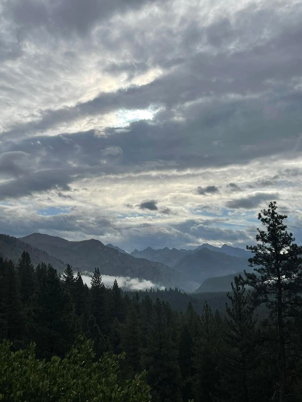 Blanket of clouds over mountain range in Idaho. Photo credit: David Foster
