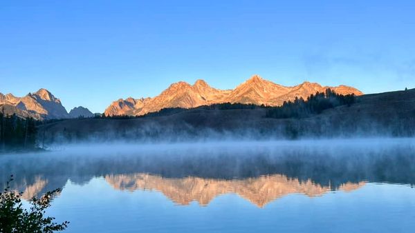 Sunrise over lake and mountains in Stanley, Idaho. Photo credit: Claudia Sanders
