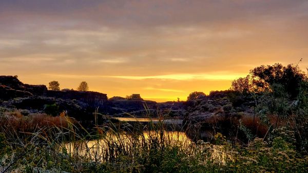 Sunset over a river in Idaho. Photo Credit: Mike Gaudreau