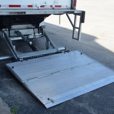 Metal loading ramp attached to a truck.