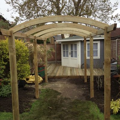 a wooden structure in the garden.