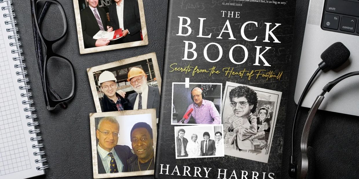 Book titled 'The Black Book' by Harry Harris on a desk with photos and headset.