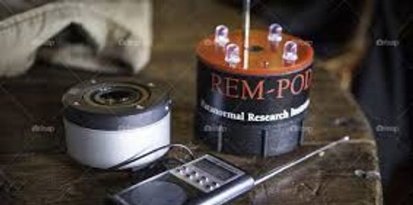Geothermal research instruments on a wooden table.