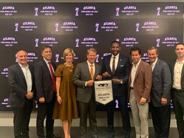 Group photo celebrating Atlanta as a FIFA World Cup 2026 host city.