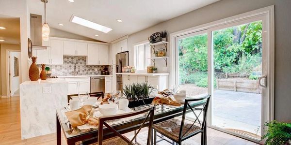 Remodeled Concord home with cascade finished island counter and open dining with slider to yard