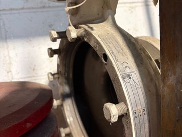 Close-up of a bolted metal pipe flange.