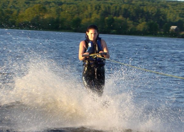 Dr. Rebecca Laginski Chiropractor doing what she loves, being pulled behind a boat waterskiing. Water sports are her favourite.