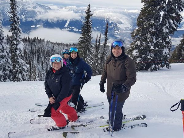 Dr. Rebecca Laginski Chiropractor at Revelstoke mountain downhill skiing with her best friends. She loves to ski in the winter to get outside and stay active