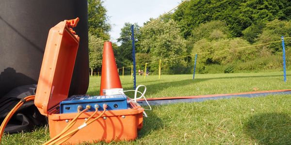 ChronoTrack timing box connected to timing mats on a finish line