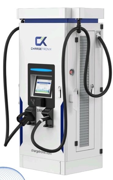 A charging station with two electric cars plugged in.