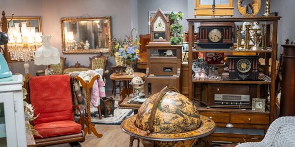 A cozy antique shop filled with vintage furniture and decor.