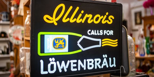Illuminated sign advertising Löwenbräu beer in Illinois.