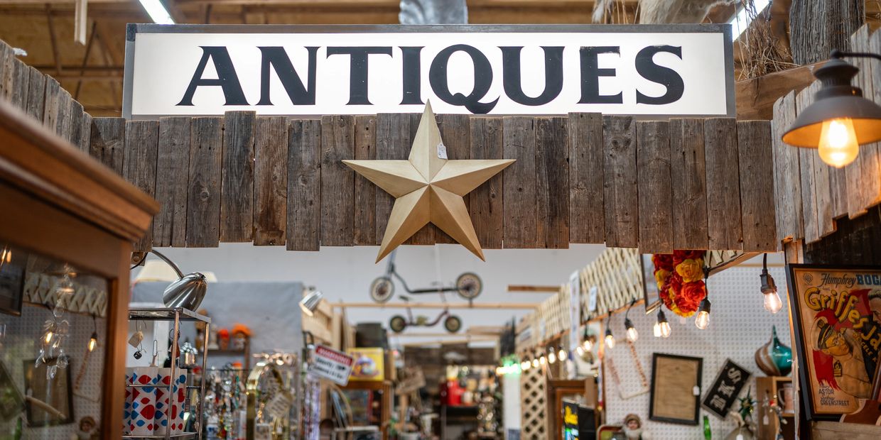 Entrance to an antiques store with rustic decor and a star.