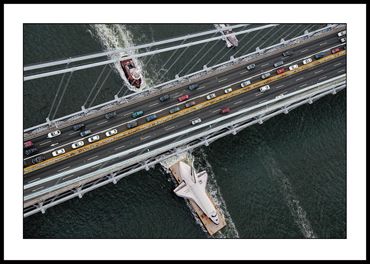 Shuttle Enterprise passes under the Verrazano Bridge on its way to the Intrepid Air and Space Museum