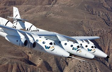 First test flight of mated pair; SpaceShip II and White Knight II near Mojave, CA- air-to-air photog