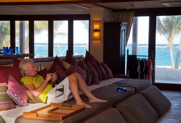 Sir Richard Branson texts on his cell phone in his Tennis Pavilion on Necker Island, BVI