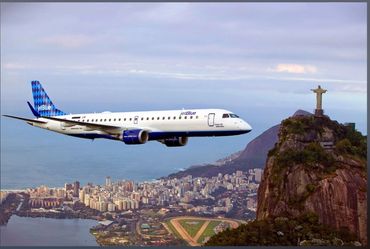 Embraer 190 over Rio De Janeiro on assignment for JetBlue Airways. Air-to-air image passing Corcovad