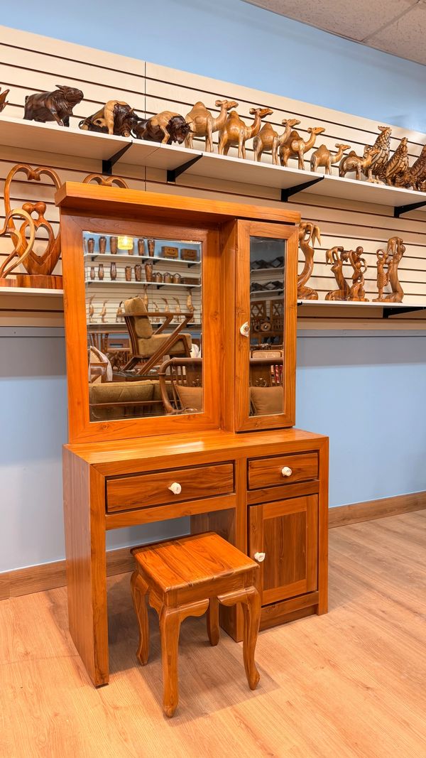 Wooden dressing table set with mirror and matching stool.