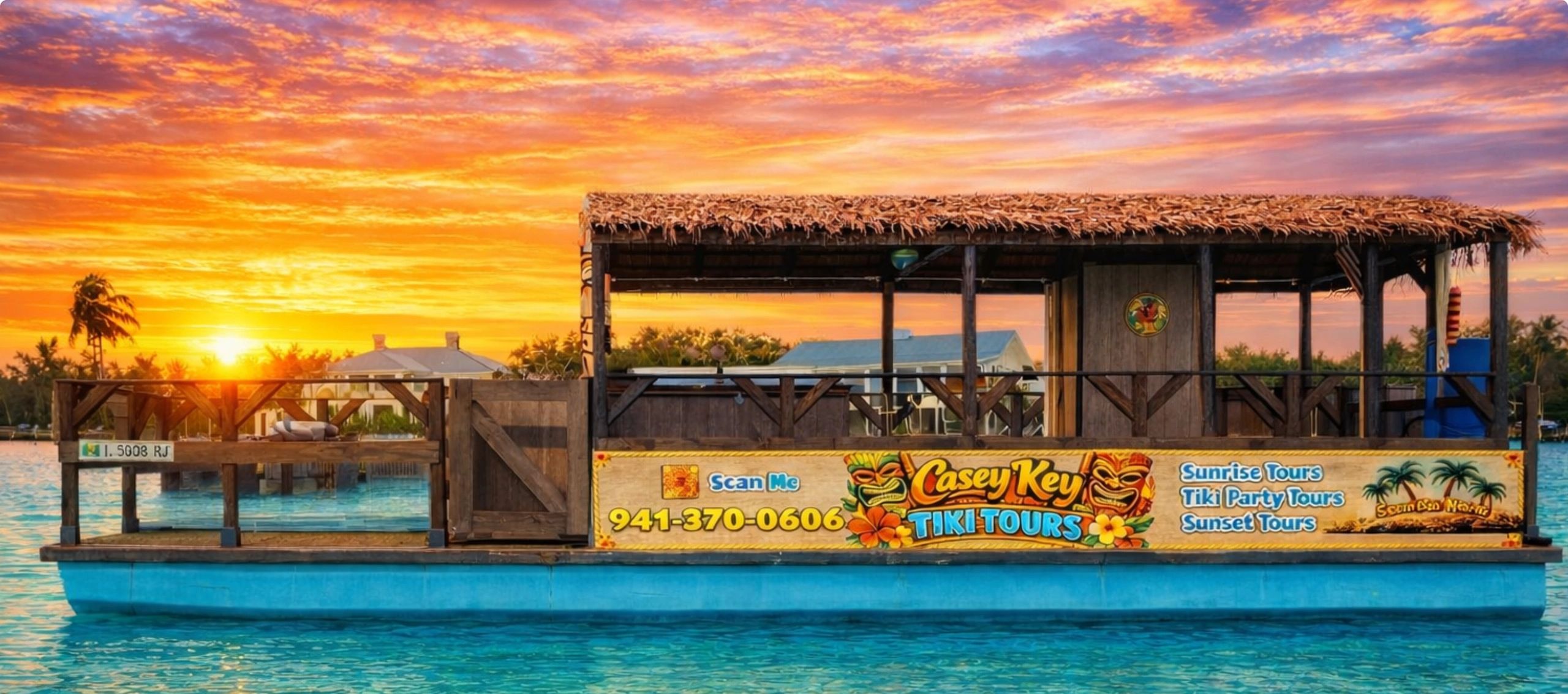 Colorful tiki tour boat at sunset on clear blue water.