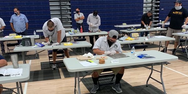 Fullerton JUHSD custodians engaged in carpet spot removal.
