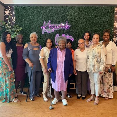 Group photo of elderly women with walking canes.