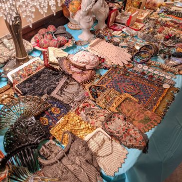 A table full of jewelry and collectibles at one of our About The House Estate Sales