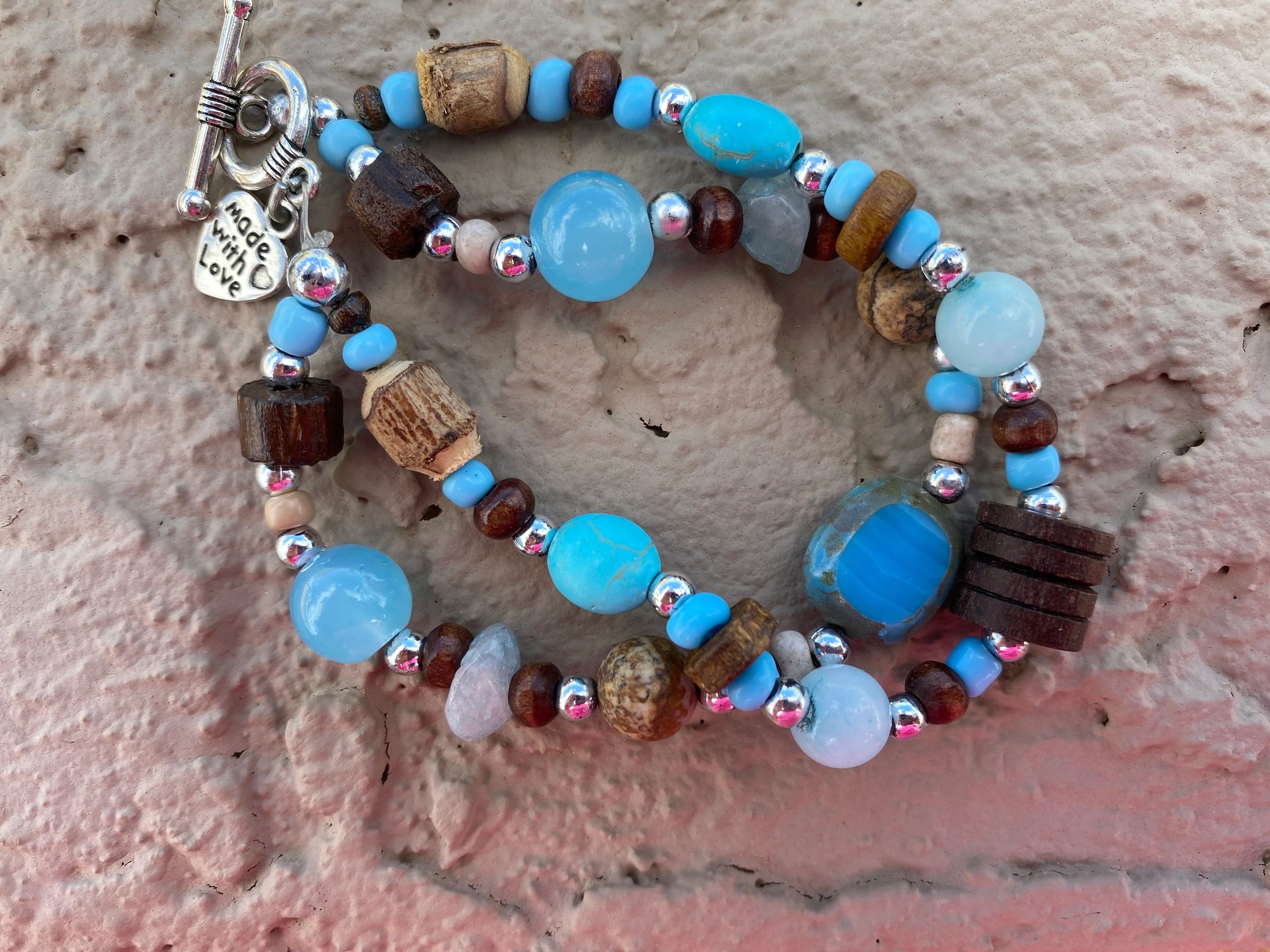 This bracelet has all of the colors of the ocean and wood. You can almost smell the salt air!