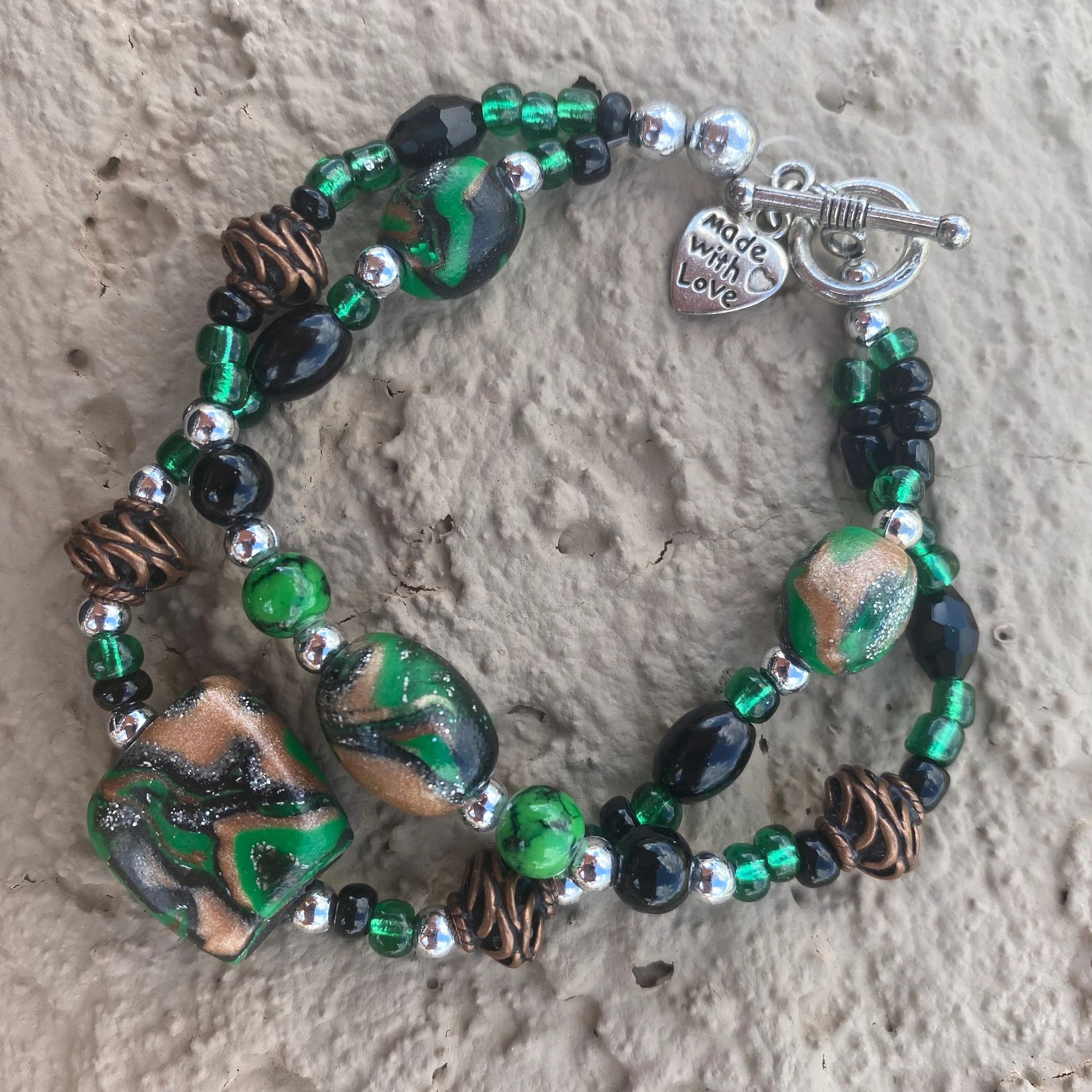 The color combination on this one is amazing!  The handcrafted clay beads pop like the galaxy!