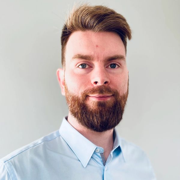 Image of private hire expert and company founder smiling at the camera