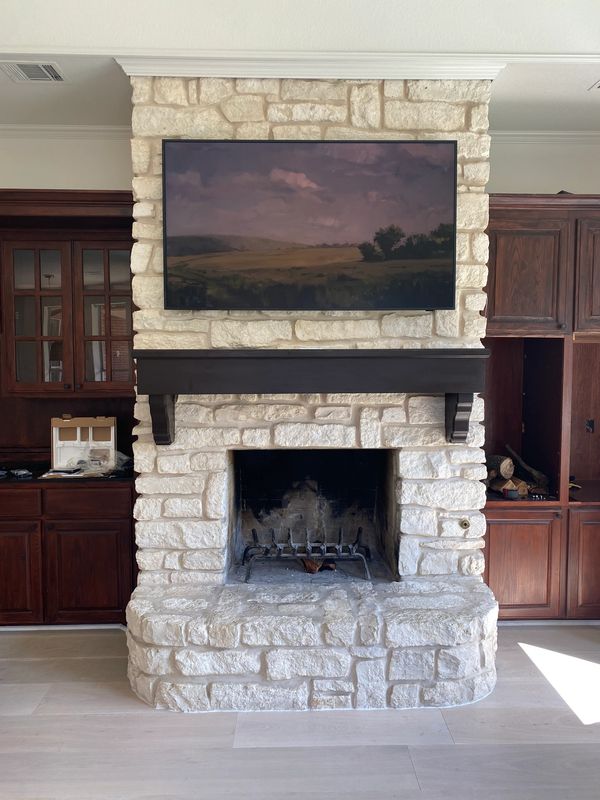 TV mounted onto stone platform.