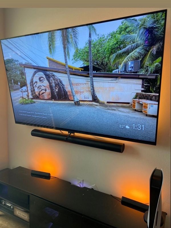 Small entertainment setup with tv mounted.