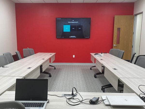 TV mounted in office meeting room.
