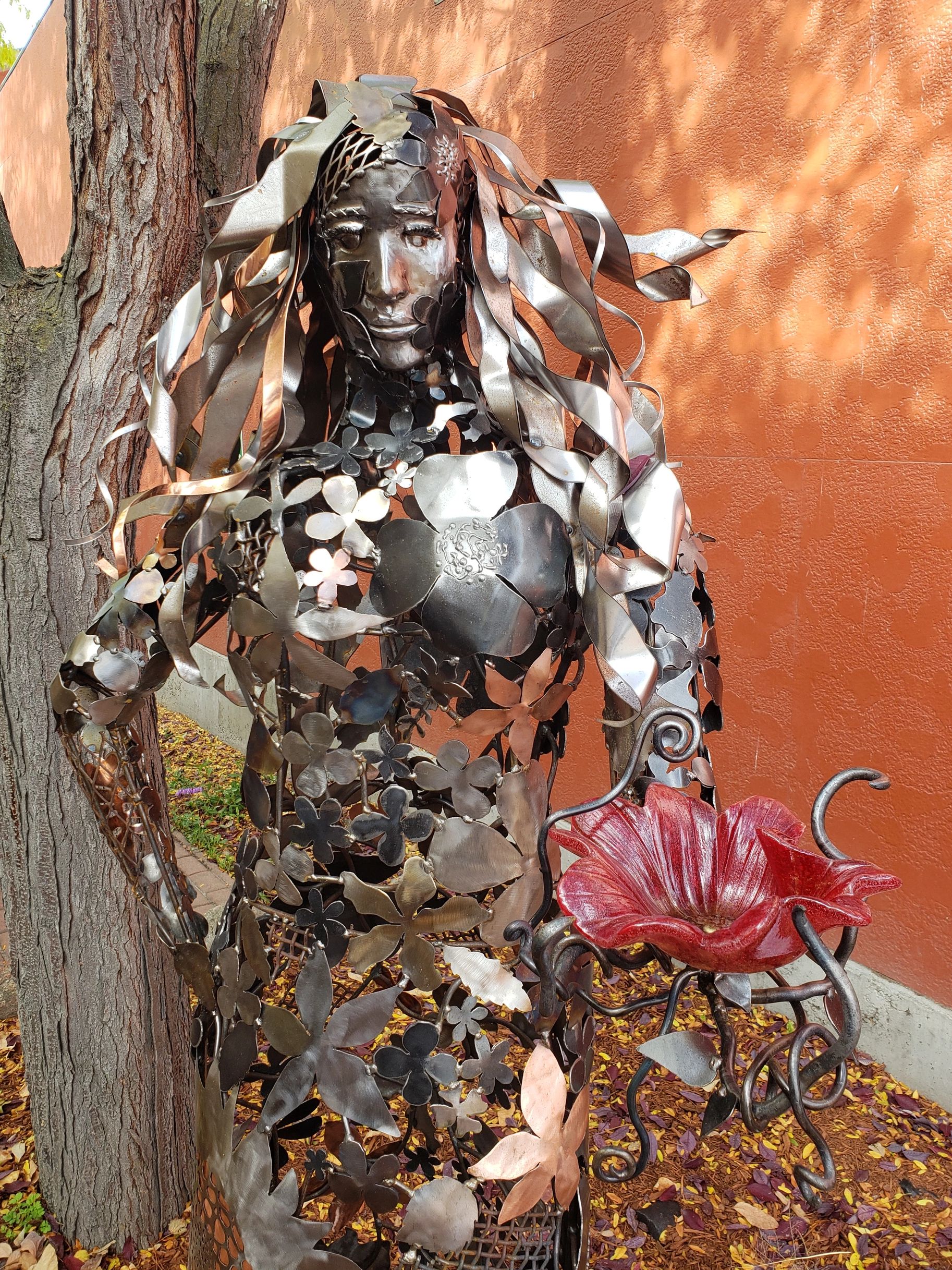 The Keeper of the Seasons — welded steel, stainless, and copper sculpture by Montana artist Laura Je