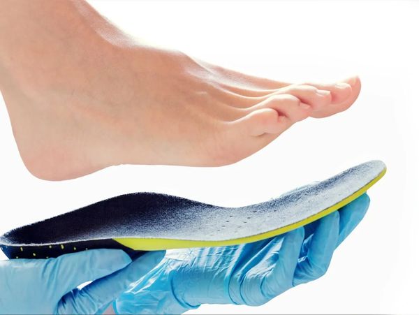 Person getting fitted with orthotics
