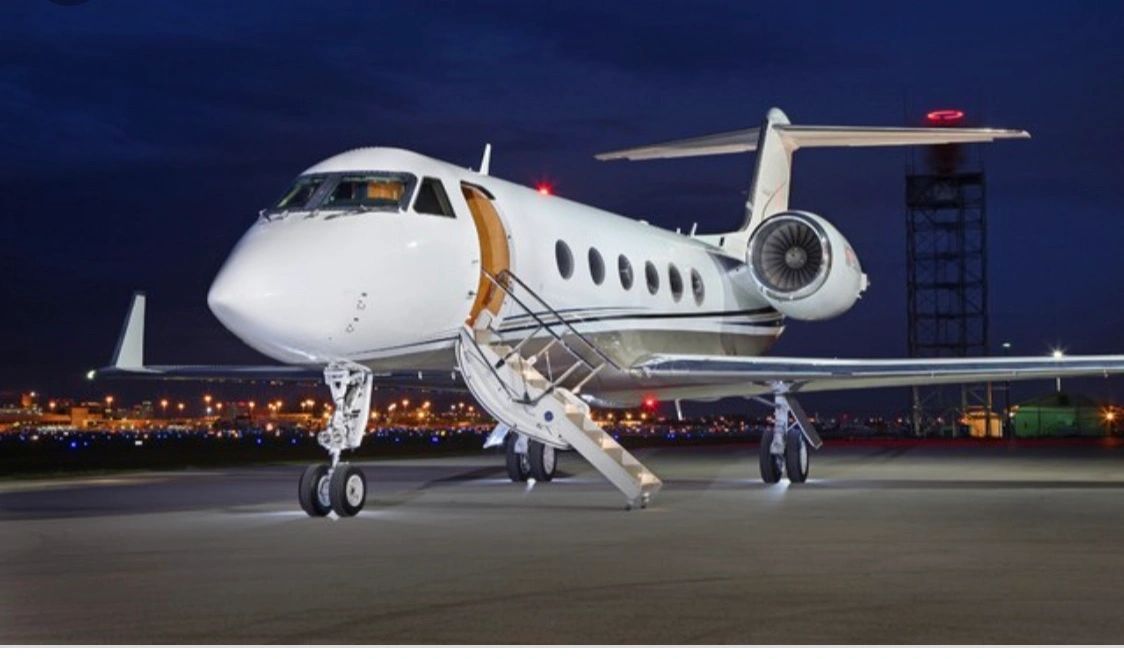 An airplane standing on runway with stairs down
