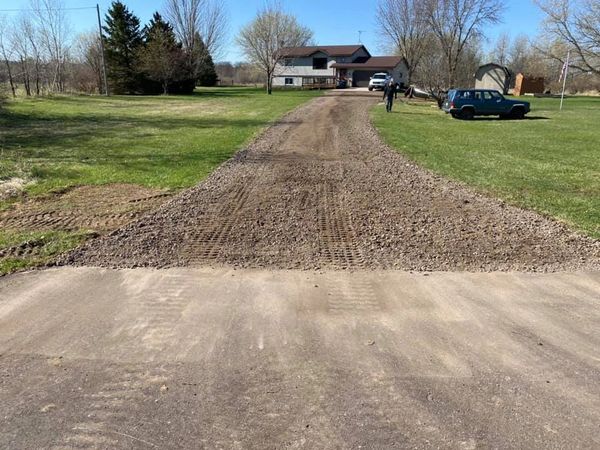 Driveway project in Chisago City. Yard regrade, prepping for concrete, garages, pole buildings.