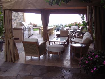 Waterproof patio enclosure with outdoor kitchen