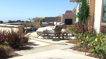 Outdoor fireplace, patio, flowerbeds, lighting, Outdoor Hot tub Jacuzzi. Lounging area