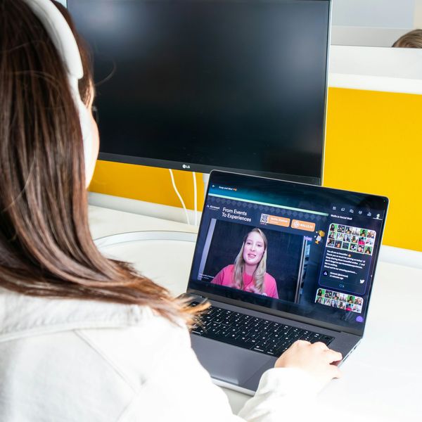 A person attending an online video conference on a laptop.