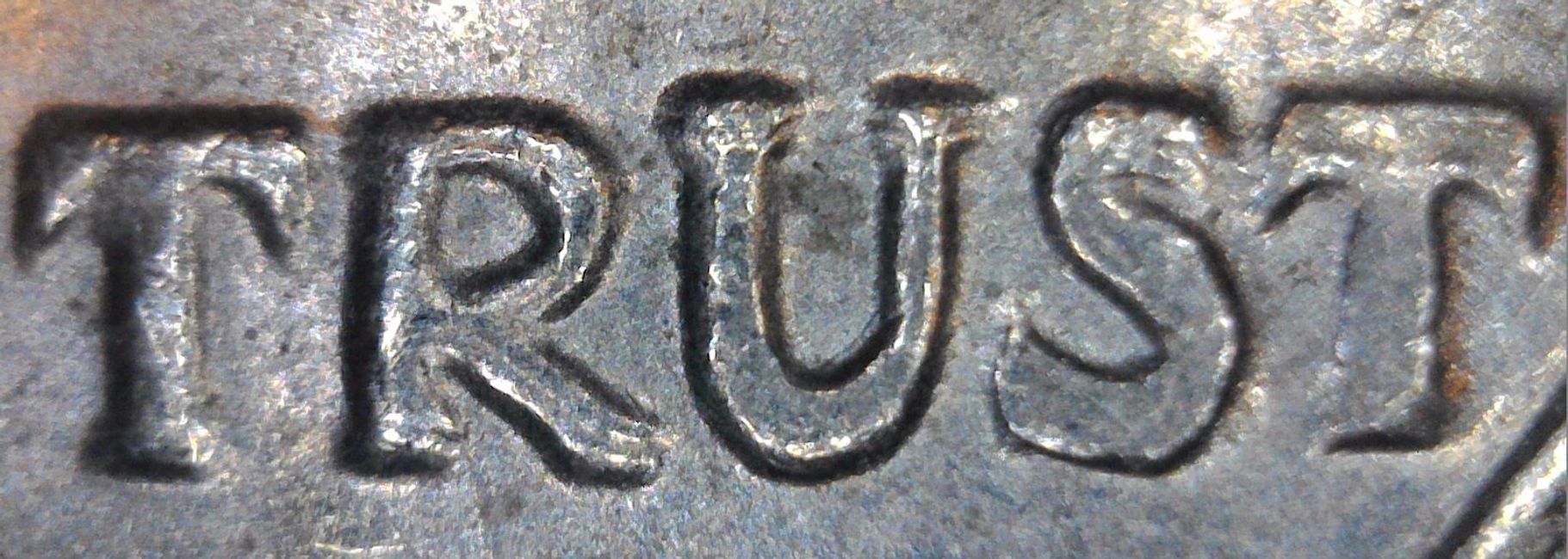 1971D Kennedy Half Dollar DDO-015, the letters in TRUST are doubled in the more valuable form of dou