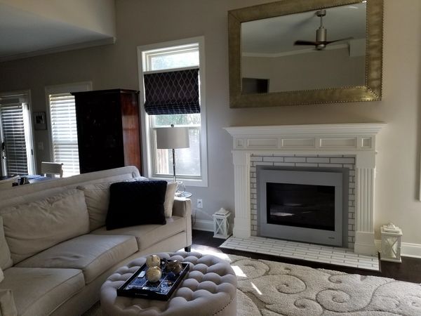 Fireplace makeover done with a Heat and Glo fireplace, new tile, and mantel