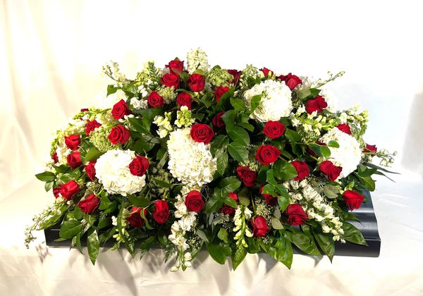 Red and white casket spray