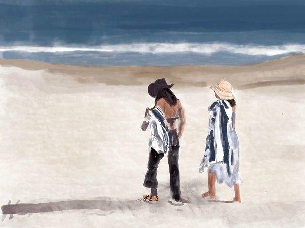 Two young women leaving the beach