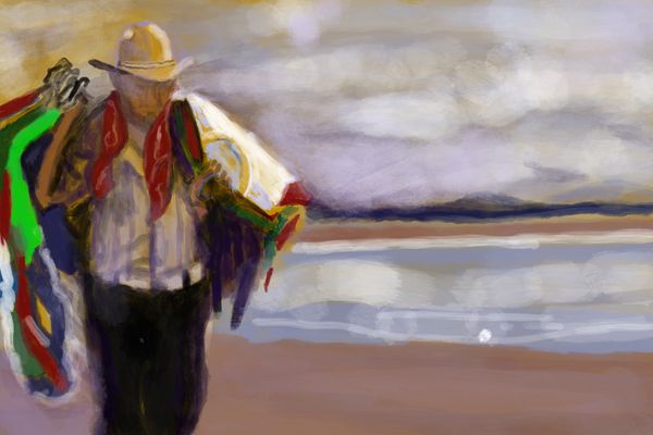 Man selling shirts on the beach