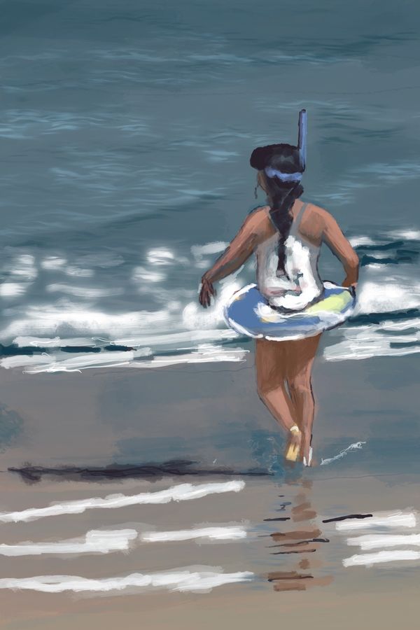 Girl heading for the ocean to snorkel